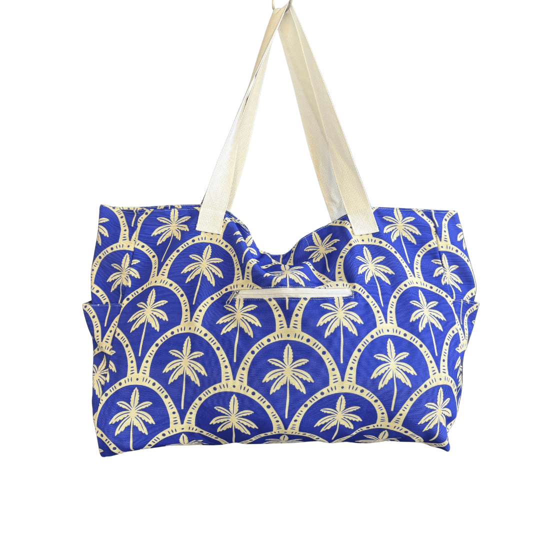 Beach Bag  made from plastic bottles. The Capri Coast design is stylish blue with white handles and detail. Transmutation