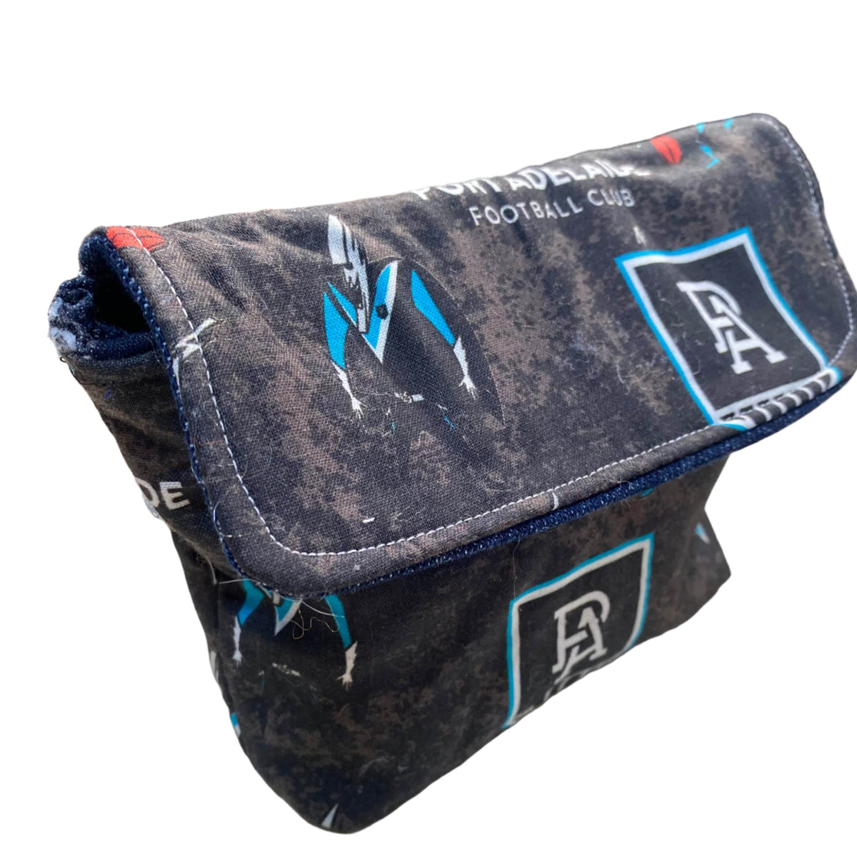 Transmutation - clutch made with old Port Adelaide textile by Chunky Monkey. Features the ALF Port Adelaide logo.