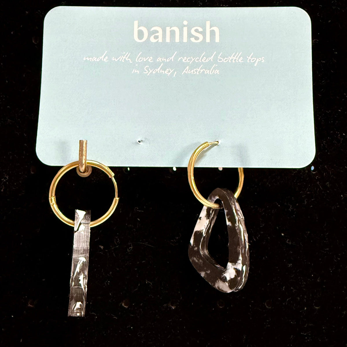 Transmutation - Earrings for all occasions in midnight black. Made from recycled plastic bottle tops on gold hoops.