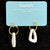 Transmutation - Earrings shaped like a sail on a yacht. A reminder to keep single use plastic out of waterways  by wearing the plastic.