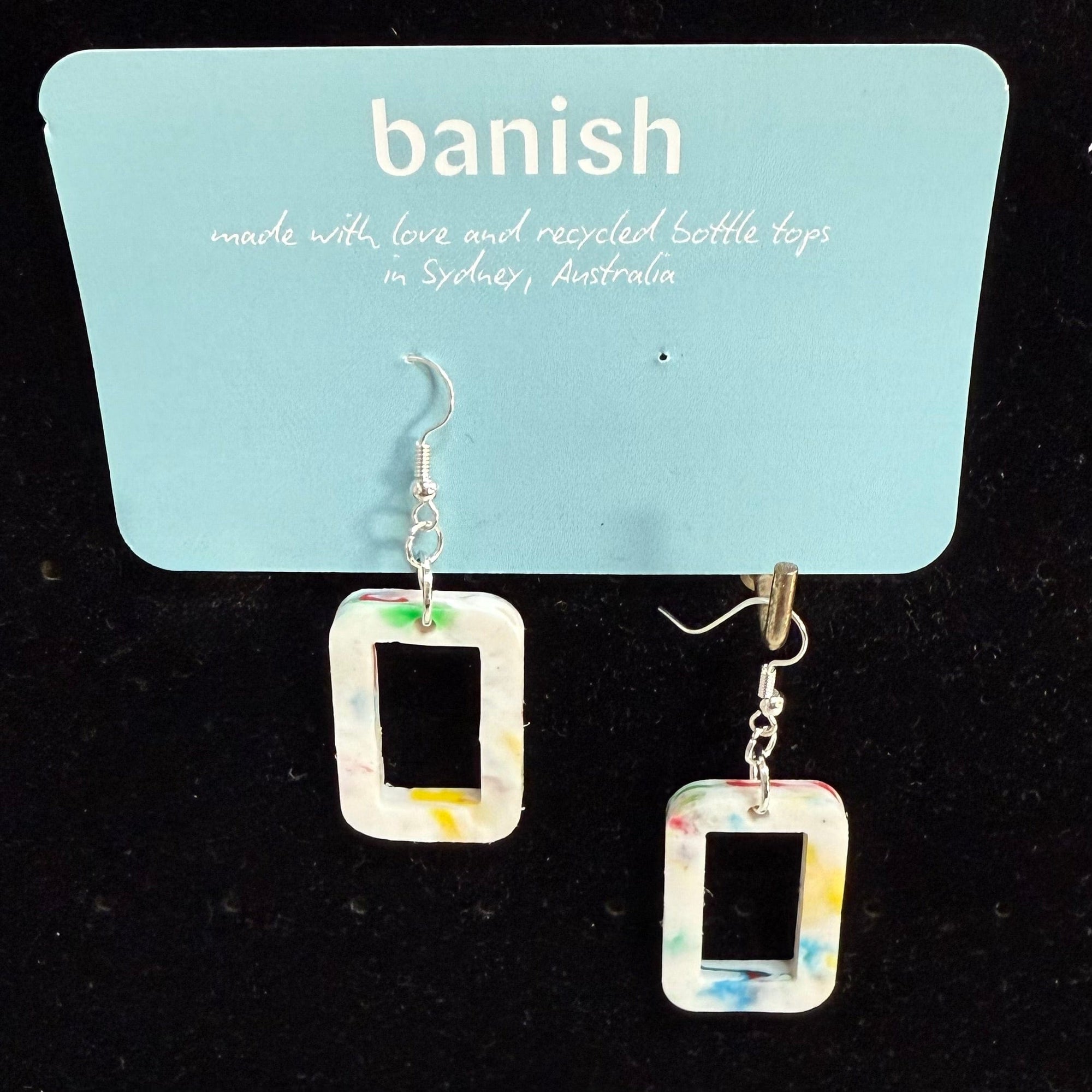 Transmutation - Earrings in the shape of a window but the colourings of a birthday cake. Made from recycled plastic.