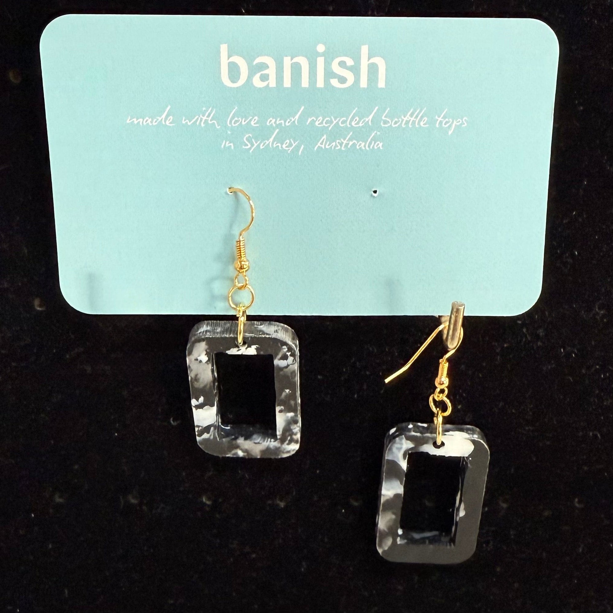 Transmutation - Earrings in the shape of a window but the colourings of a birthday cake. Made from recycled plastic.