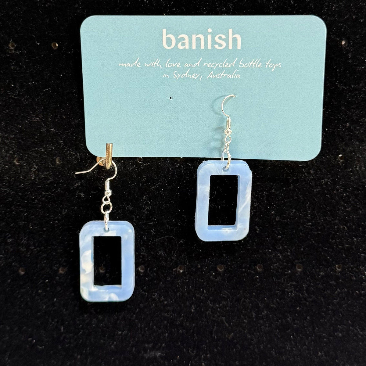 Transmutation - Earrings are little windows with a vision of the clouds and the good use of recycled plastic bottle tops.