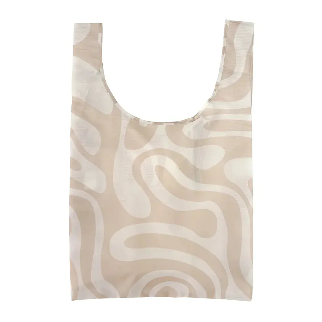 Transmutation a tote bag unfolded and made from rPET with Palm trees hearts & shells in its design.