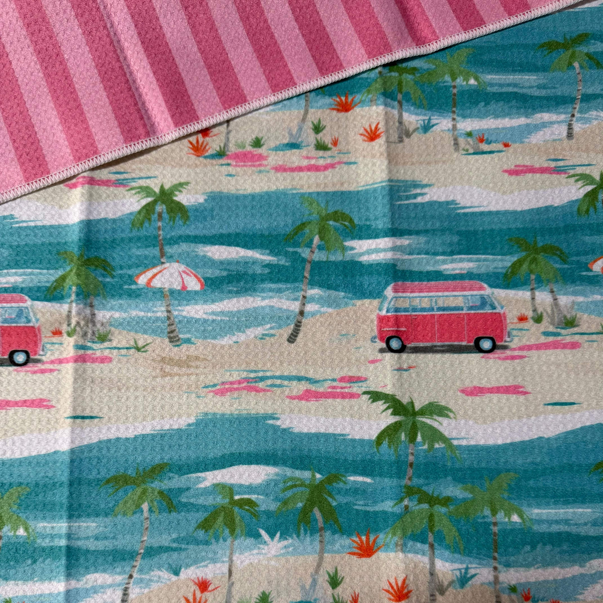 Transmutation - Made for the beaach - Bok beach life handy towel 'Sandy Toes' design has a combi van on an island and pink stripes on the back. Made from plastic PET bottles. 