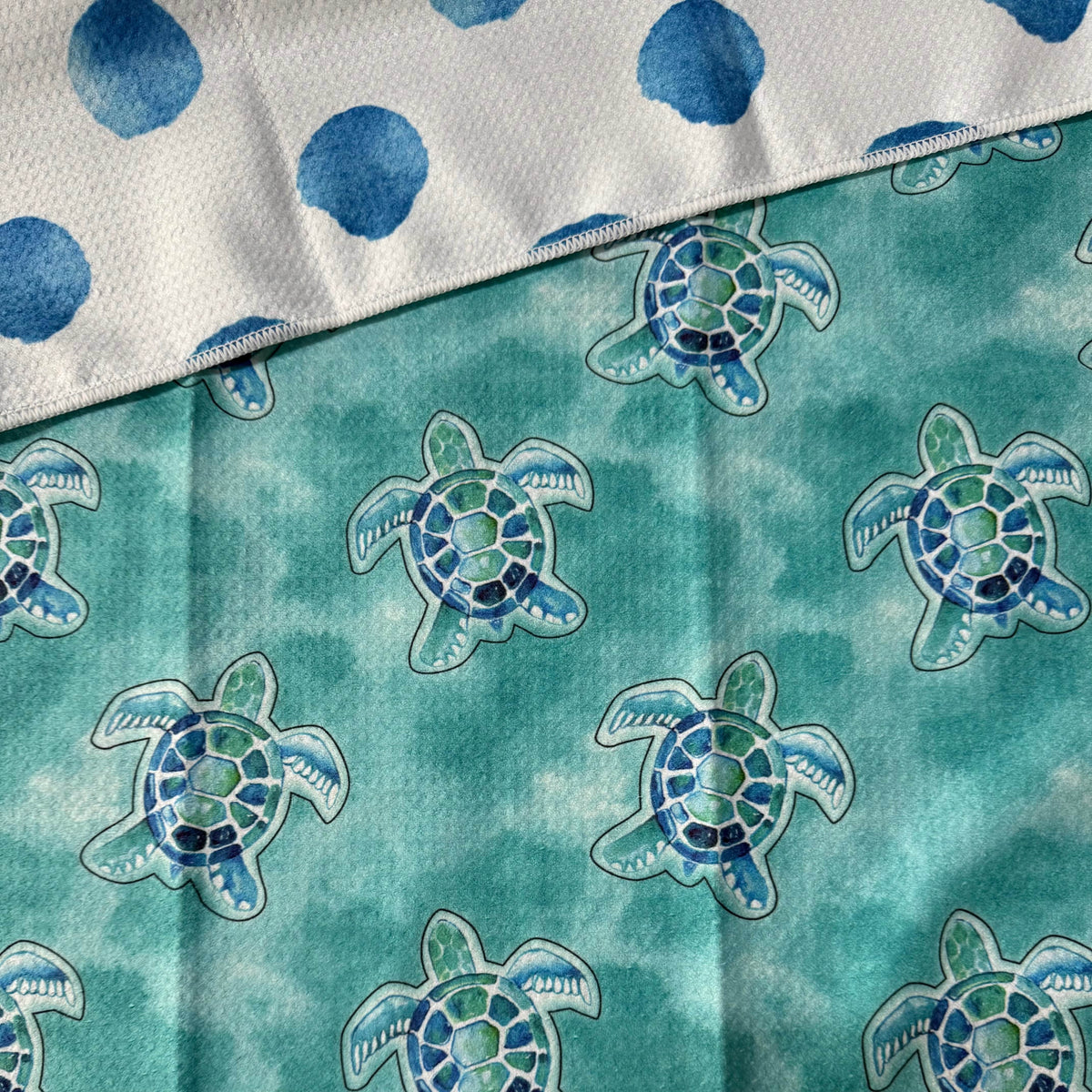 Transmutation - Turtle Cay handy towel designed by Bok Beach life. The material is made from 6 plastic bottles. Helping to reduce landfill.