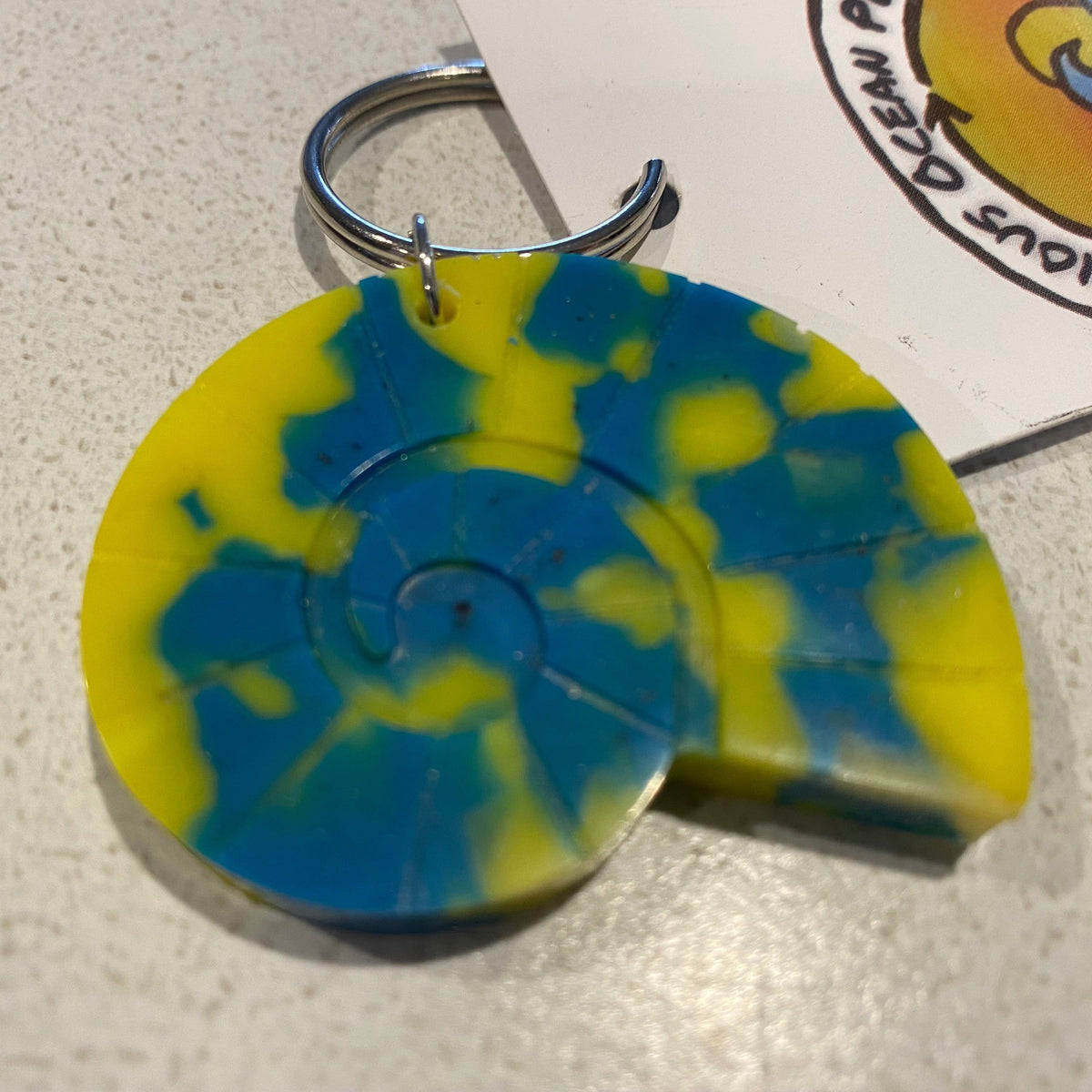 Transmutation-Precious Ocean Plastics Nautilus Keyring made from recycled single use plastics.